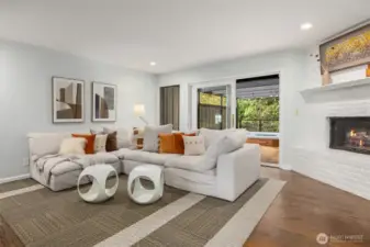 The family room, conveniently located off the kitchen, offers seamless access to the back deck for more easy indoor-outdoor living.