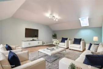 Upstairs bonus room view two. Love the cathedral ceilings up here. ***Virtually Staged***