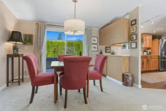 Formal Dining room opens to the living room and eating bar to the kitchen.  Sliding door access to the back patio and private courtyard.