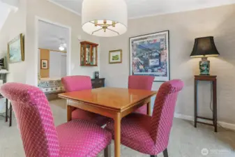 Formal Dining room opens to the living room and eating bar to the kitchen.  Sliding door access to the back patio and private courtyard.