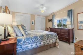Master bedroom suite overlooks the community pond and greenbelt.  Double closets, vaulted ceilings and a remodeled full bathroom with a walk in shower