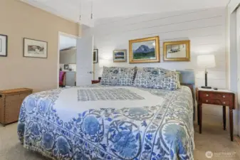 Master bedroom suite overlooks the community pond and greenbelt.  Double closets, vaulted ceilings and a remodeled full bathroom with a walk in shower