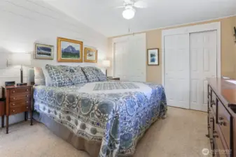 Master bedroom suite overlooks the community pond and greenbelt.  Double closets, vaulted ceilings and a remodeled full bathroom with a walk in shower