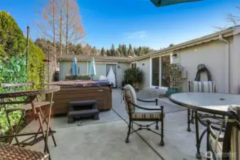 Private back patio with western exposure, turf lawn and overlooks the community pond-
