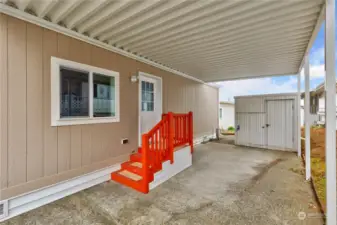 Carport with storage shed