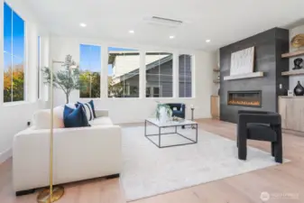 Cozy Living Room with Gas Fireplace with Floor to Ceiling Surround and Built-Ins