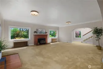 Graciously large living area with wood burning fireplace