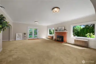 Picture windows and french doors out to patio