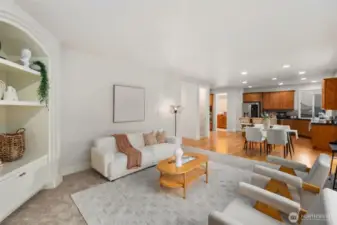 Perspective Custom built-ins in the informal great room. Cozy fireplace , new plush carpeting, fresh paint and high ceilings. Imagine the gatherings in this area of the home.  Easy access to the backyard.