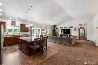 Down the wide hallway on the left is the 1/2 bath and straight ahead is the laundry room. All appliances are included.