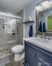 Luxurious primary bathroom with a large tile shower and dual shower heads
