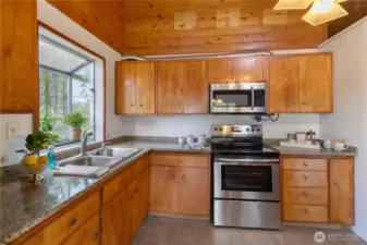 Kitchen with eating space.  Newer appliances. Window for plants or herbs!