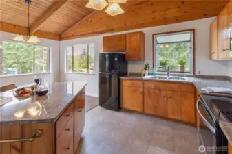 Kitchen with island and eating area.