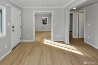 Non staged living room photo looking into office/bonus room