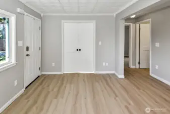 Living room looking at french doors that are closed into office space