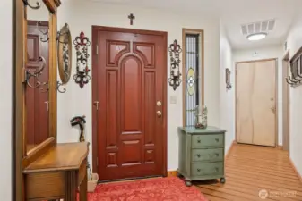 Inside the front door. The door at the end of the hallway is the office.