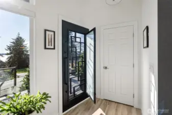 This steel entry door adds to the contemporary and modern look of the front of the home while providing the ability to open the door, let fresh air in but keep the door locked. Security on beautiful days.