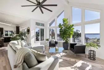 The vaulted ceiling makes this space larger than it is. Light and bright, modern ceiling fan and new motorized window treatment which can be operated from afar from your phone.