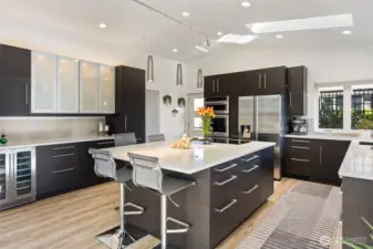 Kitchen cabinets designed with great thought and imagination. Things right where you need them. European closures, a wine and beverage refrigerator where you need it for making and serving beverages off to the side of the main island. Cabinet lighting adds that ambiance for evenings. Above, interior and below with options for any look and feel you are after. The island has storage for larger items underneath.