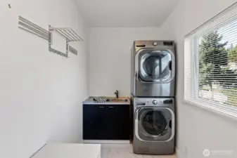 Mud and Laundry just off the back door and stairs down to the gardens. Easy to clean up and do your laundry just off kitchen where main level living happens. Light and bright with this new large window.