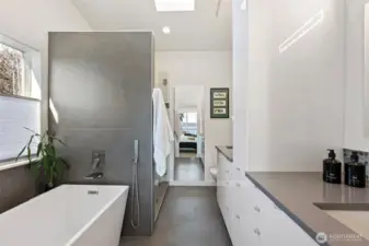 The large soaking tub and beautiful walk in showing in spa like finishes. A lovely retreat from hot tub to bath.