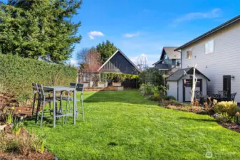 A gate off the driveway (not shown here) allows for easy delivery of gardening supplies.