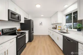 Updated kitchen featuring new cabinetry and quartz countertops.