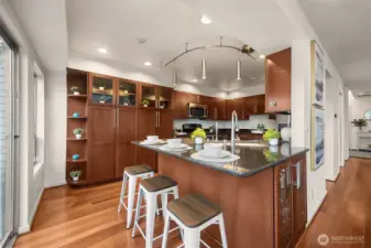 Kitchen maintains a chef triangle and plenty of cabinetry for pantry space