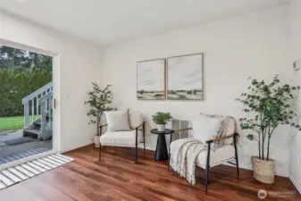 Lower level slider leading to hot tub and back yard