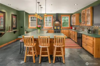 The 2nd kitchen with breakfast bar, honed slate countertop and custom lighting