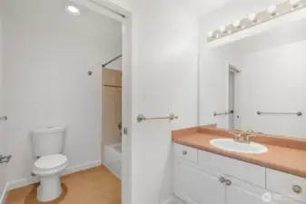 The full bath on this floor with a tiled surround and the new flooring goes into the bath as well.