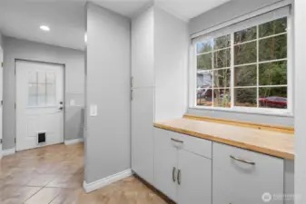 Laundry/Utilities/Mud  Room with extensive storage and pantry closet
