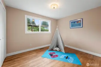 Hardwood floors in second bedroom dowstairs.