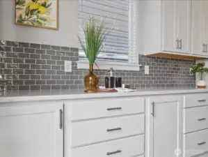 Plenty of counter and cabinet space.  Beautiful tile backsplash!