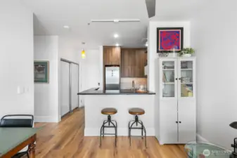 Open concept layout where owner added in the convenient breakfast bar with the full kitchen remodel!