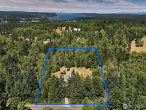 Look at all the forest surrounding you! So private and yet close to Robinson Beach, Double Bluff Beach and Freeland amenities. Enjoy your arrival as you meander down Lancaster Road to your gated driveway.