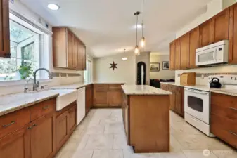 Another perspective of the kitchen. Let's go check out the Primary Suite via the office (arched door in the distance).