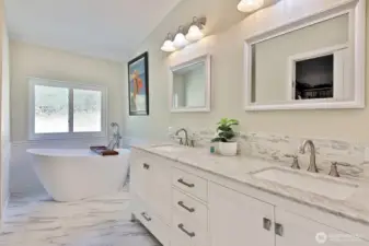 Luxurious Primary Bath with a soaking tub and walk-in closet.
