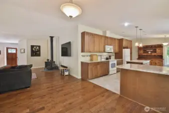 Let's go check out the 2nd Bedroom and 2 Flex Rooms via the hallway beyond the wood stove and to the right.