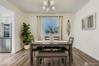 This spacious and beautifully appointed dining area offers both elegance and practicality, providing a perfect setting for meals and entertaining. Its convenient location directly off the kitchen streamlines meal preparation and service, making it an ideal space for everyday use and special occasions alike.