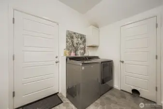 The practical and functional mud room/utility room offer exceptional convenience, being directly accessible and conveniently situated immediately off the garage, streamlining everyday routines and making household tasks significantly easier.