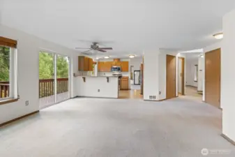 Spacious family room with deck offering gorgeous views