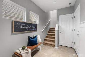 Your entry is roomy with a large closet and right off the garage.