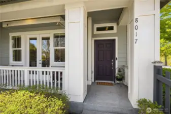 A covered front porch beckons you inside. French doors lead to the lower level den/office.