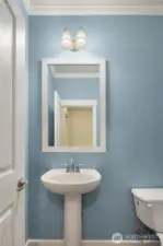 Half bath with pedestal sink.