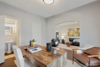 Perspective from office/library to living room. Note the 1/2 bath on this level.