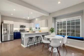 Large kitchen is open to dining. We love the window seat with custom cushion.