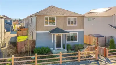 Stanwood Beauty | 4 Bedrooms | 2.25 Baths | Just Shy of 2,000 Sq Ft. Welcome home to this beautifully designed residence offering nearly 2,000 square feet of thoughtfully planned living space. Featuring 4 bedrooms and 2.25 baths, this home showcases an open-concept great room layout on the main level — perfect for both everyday living and effortless entertaining. The 9-foot ceilings enhance the sense of space, light, and comfort throughout. Enjoy exceptionally private and quiet living, paired with charming street appeal. Sidewalk-lined streets welcome you home, while rear-facing garages create a clean, inviting front elevation. You’re just a short stroll to the local coffee shop and corner store — small-town convenience at its best.    Stanwood offers a boutique-style lifestyle in rural Snohomish County, blending the quaint charm of Old Town with the modern conveniences of its newer districts. Enjoy local shopping, restaurants, and even a movie theater, all while maintaining that treas