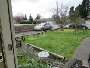 Level Sunny Front yard with flower beds