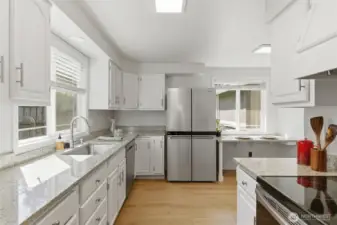 Stainless steel appliances and eat in kitchen counter tops